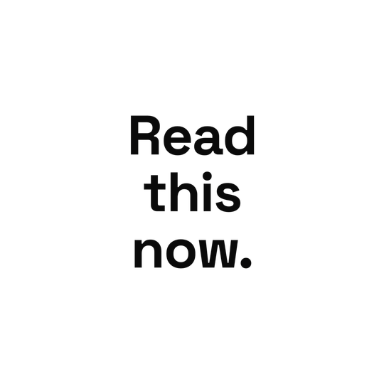 “Read this now.” in dark grey on black, barely visible.