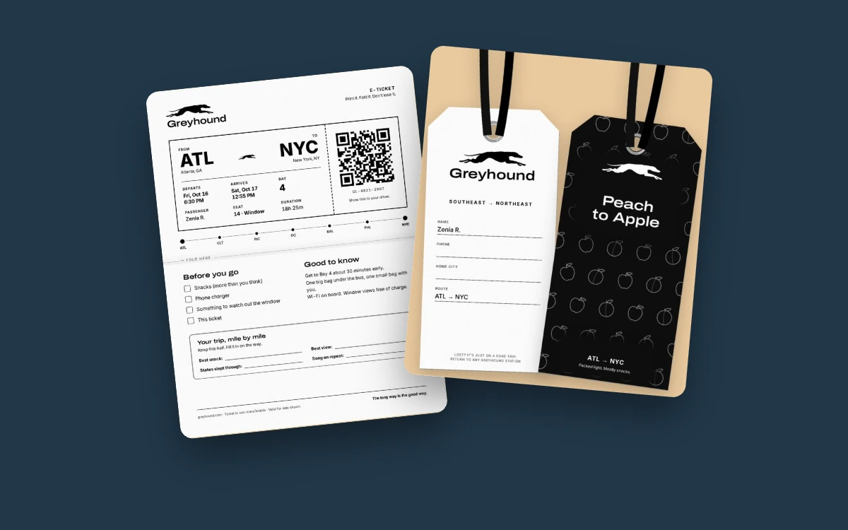 The Greyhound print-at-home ticket from Atlanta to New York next to two luggage tags, one white and one black reading “Peach to Apple”, on dark blue.